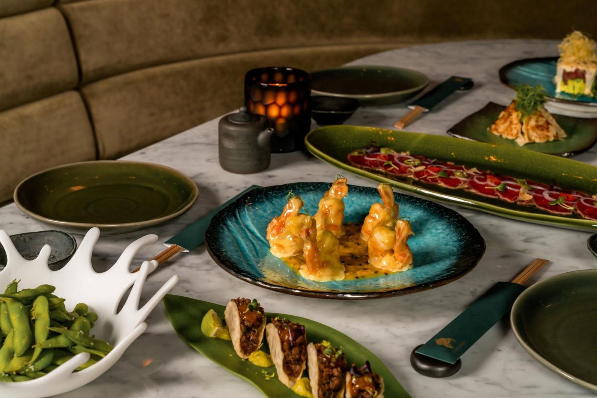 The Dubai Edition Luaran gambar A selection of dishes at the restaurant